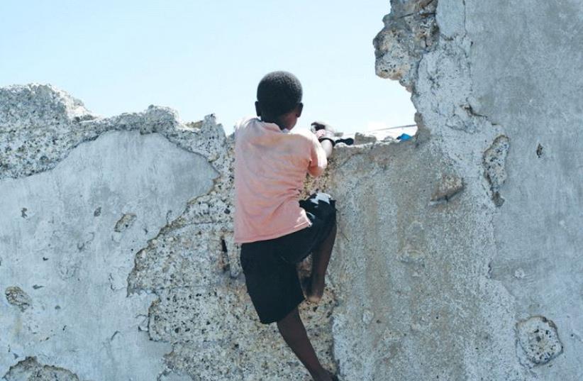 WILL HAITIAN children be empowered or kept in permanent impoverishment? (photo credit: REUTERS)