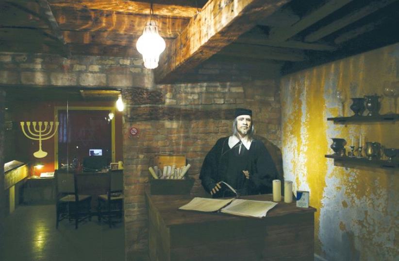 AN EXHIBIT in a Venice museum that used to be the ‘Banco Rosso’ pawnshop in the 16th century. (photo credit: REUTERS)