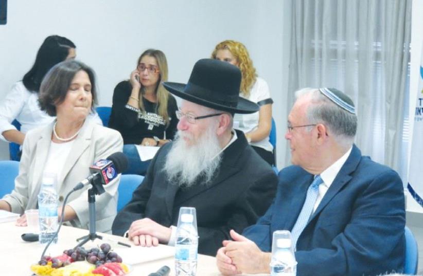 HEALTH MINISTER Ya’acov Litzman is flanked by Prof. Jonathan Halevy and Dr. Osnat Luxenburg at a meeting of the ‘health basket committee’ last month. (photo credit: JUDY SIEGEL-ITZKOVICH)