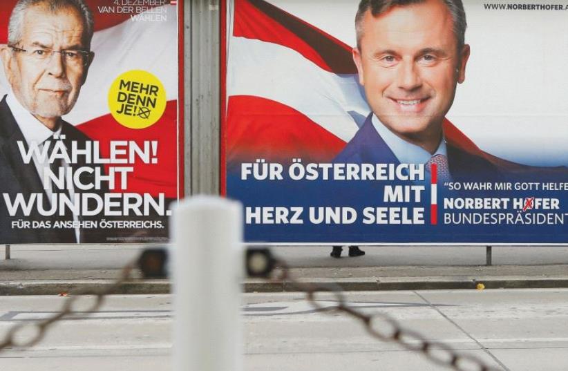 PRESIDENTIAL ELECTION campaign posters of Alexander Van der Bellen (left) and Norbert Hofer are seen in Vienna. (photo credit: REUTERS)
