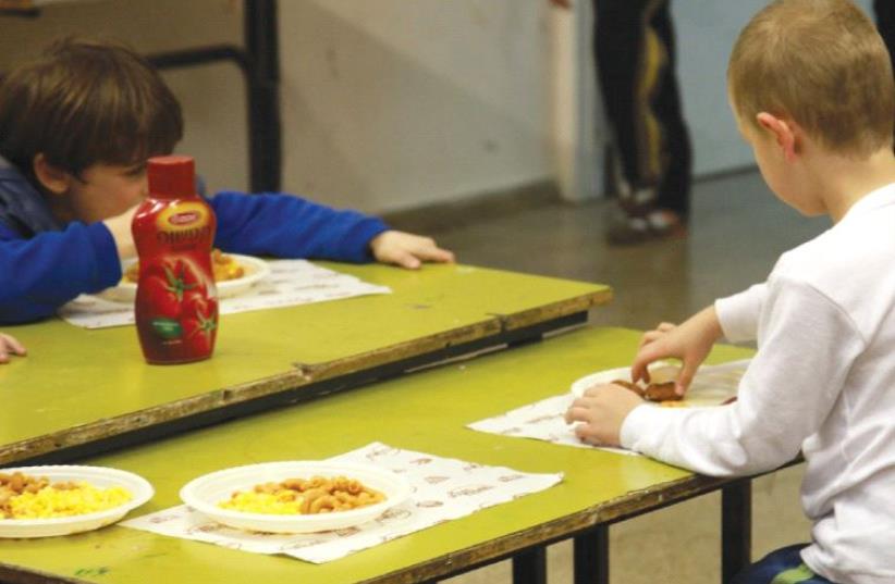 EATING HABITS acquired in youth help determine those habits in years to come. (photo credit: MARC ISRAEL SELLEM/THE JERUSALEM POST)