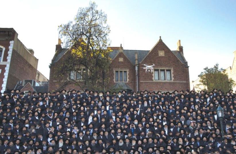 CHABAD EMISSARIES gather in front of the Chabad-Lubavitch world headquarters in Brooklyn in 2015 (photo credit: REUTERS)