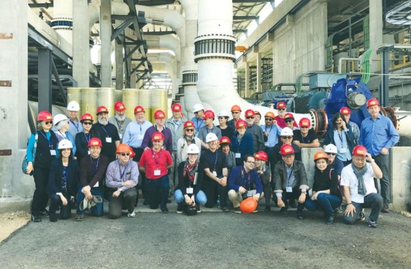 PARTICIPANTS IN the JNF’s tour of water management solutions pose during a visit on Monday to the Sorek desalination plant near Rishon Lezion, the largest such facility in the world. (photo credit: TALIA TZOUR AVNER)