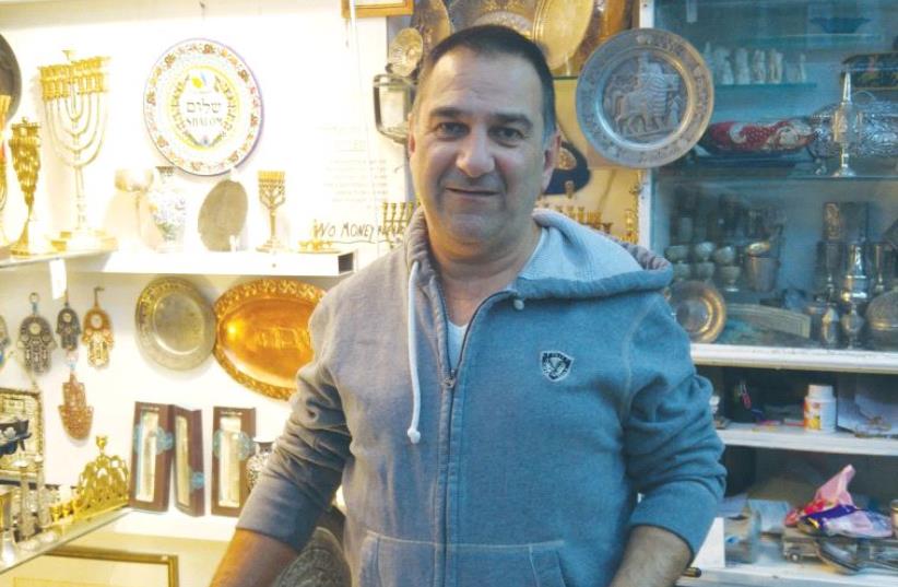 SHMUEL GHATAN, a Jerusalem store owner, says he would like to see the US Embassy moved to the capital. (photo credit: DANIEL K. EISENBUD)