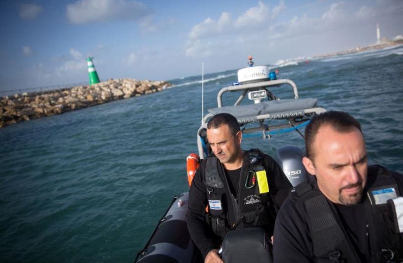 Erman Skyman, (R) the Superintendent of the Tel Aviv police coastal patrol unit and Shlomo Maman, 44, an officer.  (photo credit: MIRIAM ALSTER)