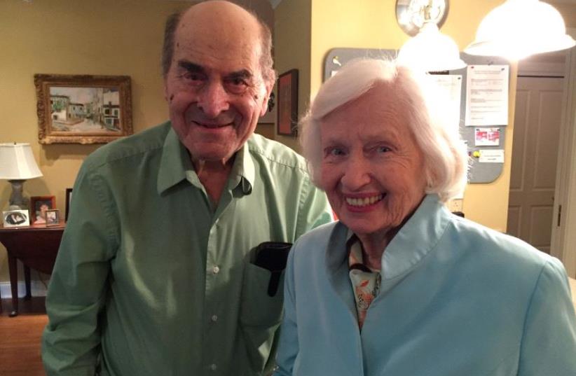 Dr. Henry Heimlich (L), the 96-year-old Cincinnati surgeon credited with inventing the life-saving technique named for him, poses with Patty Ris, 87. (photo credit: REUTERS)