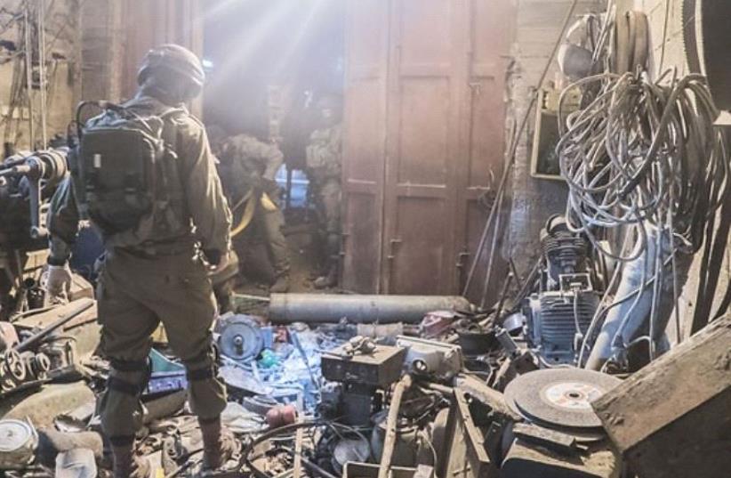 IDF uncovers large weapons-making factory in Hebron basement  (photo credit: IDF SPOKESPERSON'S UNIT)