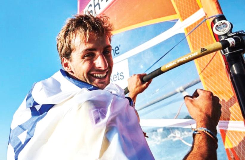 Israeli windsurfer Yoav Omer continued his dominance of youth windsurfing by clinching first place yesterday at the RS:X competition at the Youth Sailing World Championship in Auckland, New Zealand. (photo credit: RS:X YOUTH WORLDS WEBSITE)