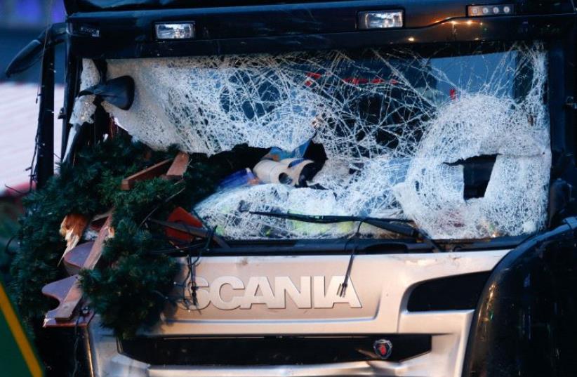 A damaged windscreen of a truck which ploughed through a crowd at a Christmas market in Berlin, Germany, December 20, 2016 (photo credit: REUTERS)