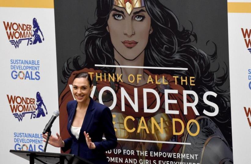Actress Gal Gadot speaks during a ceremony as the UN names the comic character Wonder Woman its Honorary Ambassador for the Empowerment of Women and Girls during a ceremony at the United Nations Economic and Social Council Chamber on October 21, 2016, in New York (photo credit: TIMOTHY A. CLARY / AFP)