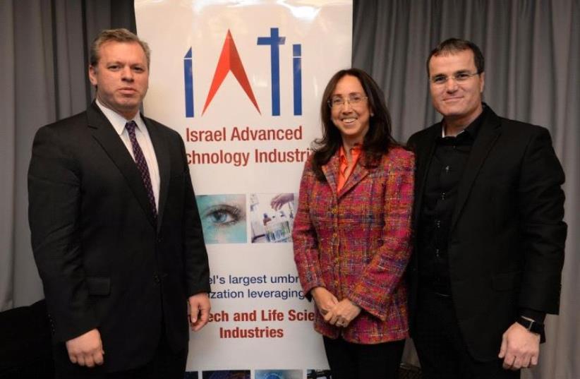 Left to right: Prime Minister’s Office director general Eli Groner, IATI CEO Karin Mayer Rubinstein, co-chairman of IATI Erez Tsur (photo credit: NIR SHMUL)