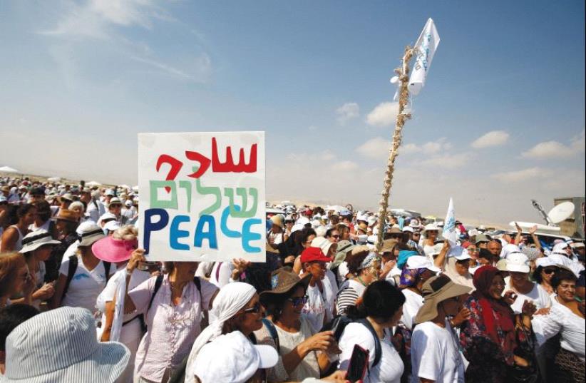 PRO-PEACE DEMONSTRATORS take part in a march in October. The author argues that Israel needs to concentrate on making peace with the Palestinians. (photo credit: REUTERS)