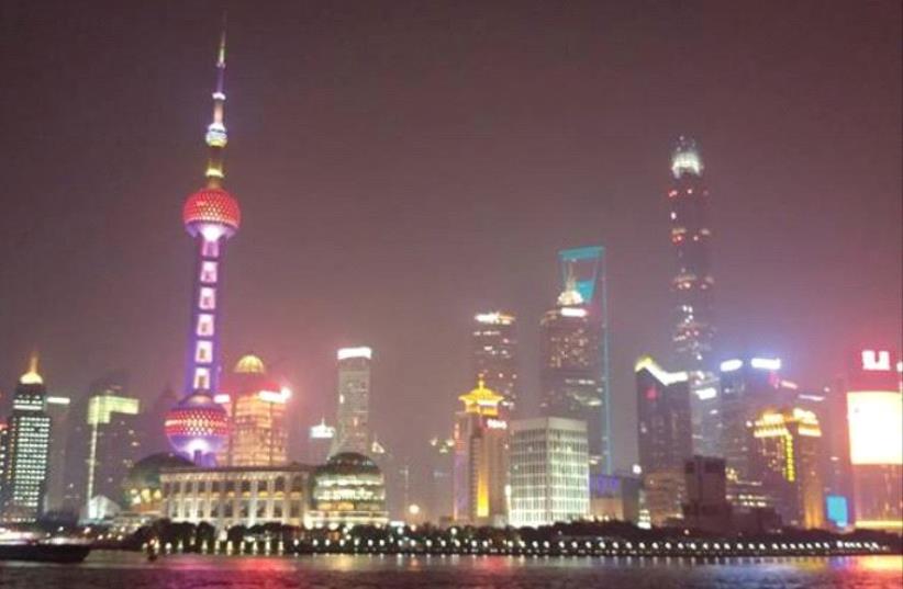 A NIGHTTIME view of the Shanghai skyline. (photo credit: AVI MUSKAL)