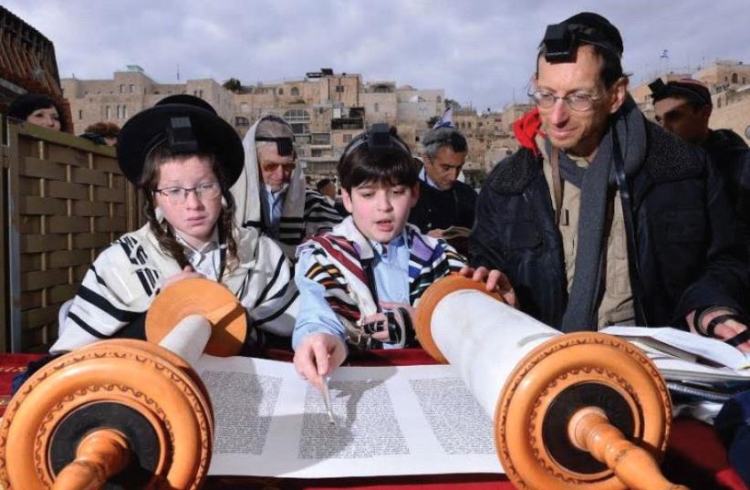 TZVI PERKAL with William Haberman and William’s father at the Western Wall. (photo credit: LIRAN SHEMESH)