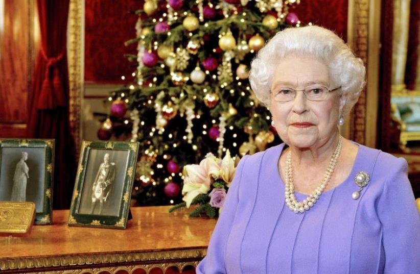 Britain's Queen Elizabeth in Buckingham Palace after recording her Christmas Day television broadcast to the Commonwealth, [File 2014] (photo credit: REUTERS)