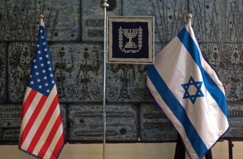 US and Israeli flags (photo credit: REUTERS)