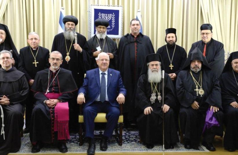 PRESIDENT REUVEN Rivlin assembles leaders of Christian communities for a traditional group photo at his annual reception marking the civil new year (photo credit: MARK NEYMAN / GPO)