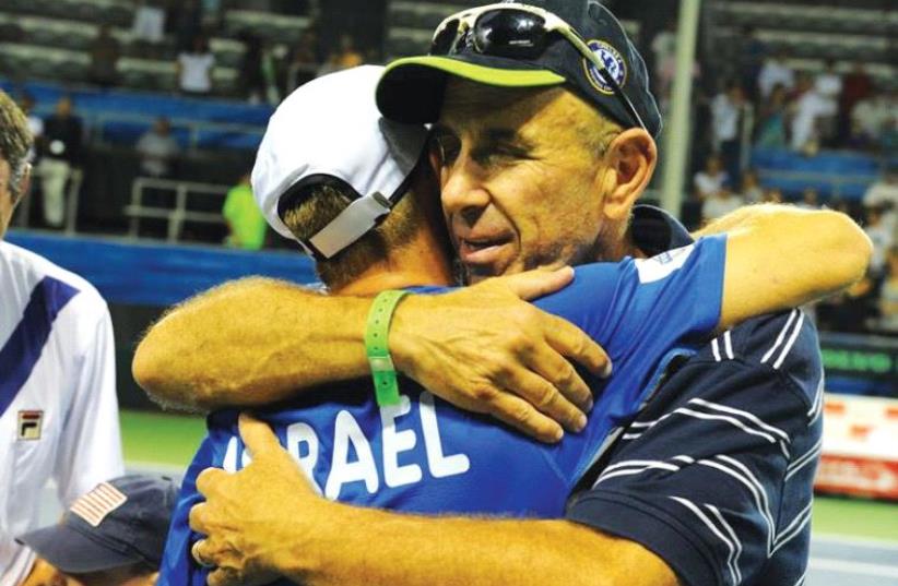 Israel Tennis Association CEO Shlomo Glickstein embracing Dudi Sela (photo credit: ISRAEL TENNIS ASSOCIATION)