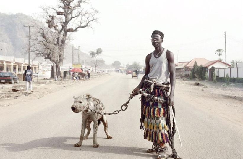Pieter Hugo, from the series The Hyena and Other Men, ‘Mallam Galadima Ahmadu with Jamis,’ Nigeria, 2005 (photo credit: TEL AVIV MUSEUM OF ART)