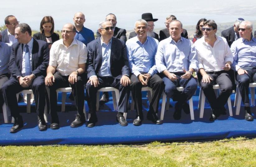 The government members pose for a group photo prior to the weekly cabinet meeting that was held in April at the Golan (photo credit: REUTERS)