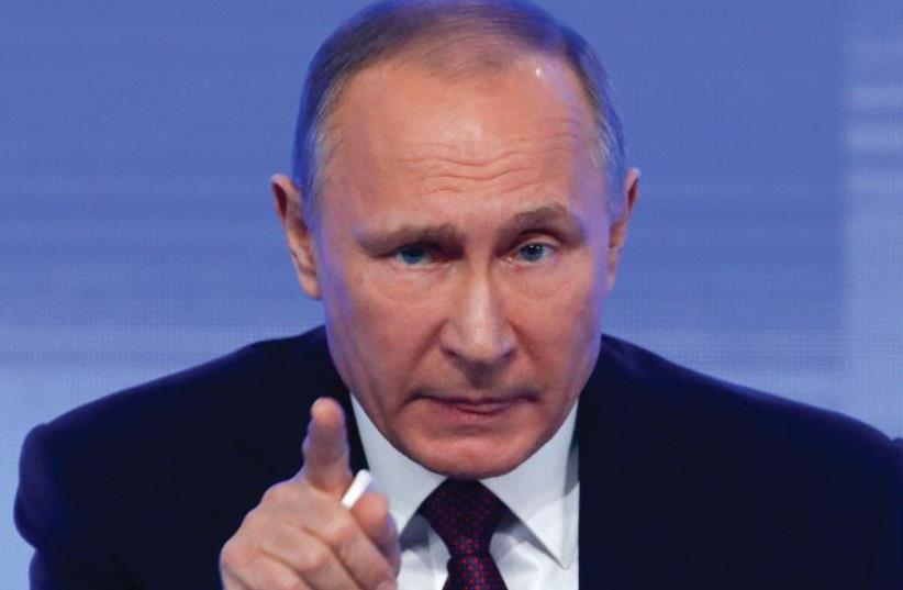 RUSSIAN PRESIDENT Vladimir Putin speaks during a news conference in Moscow in 2016. (photo credit: REUTERS)