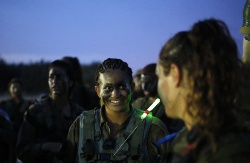 Israeli soldiers of the Caracal battalion take part in a march May 29, 2014. (photo credit: REUTERS)