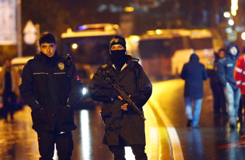 Police secure an area near an Istanbul nightclub, following a gun attack, Turkey, January 1, 2017 (photo credit: REUTERS)