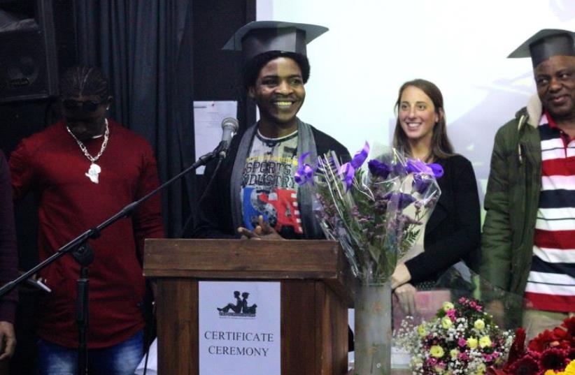 Gasim Ali, 24, gave a speech Wednesday night after accepting his graduation diploma  (photo credit: COURTESY SCHOOLHOUSE)