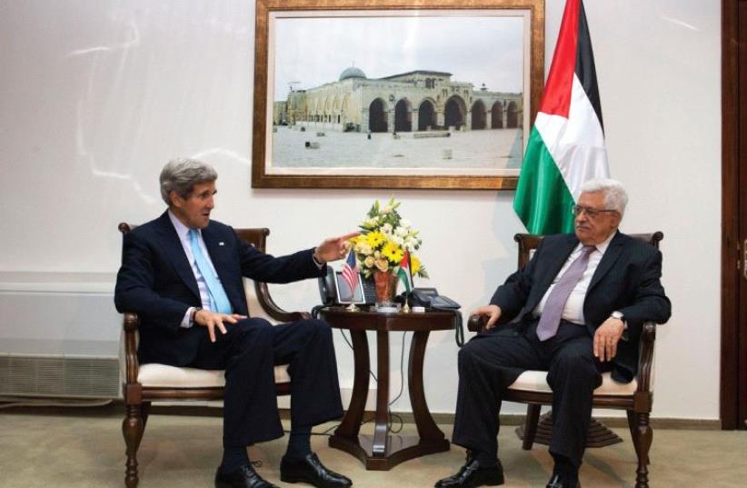 US SECRETARY of State John Kerry meets Palestinian Authority President Mahmoud Abbas in Ramallah in 2013. (photo credit: REUTERS)