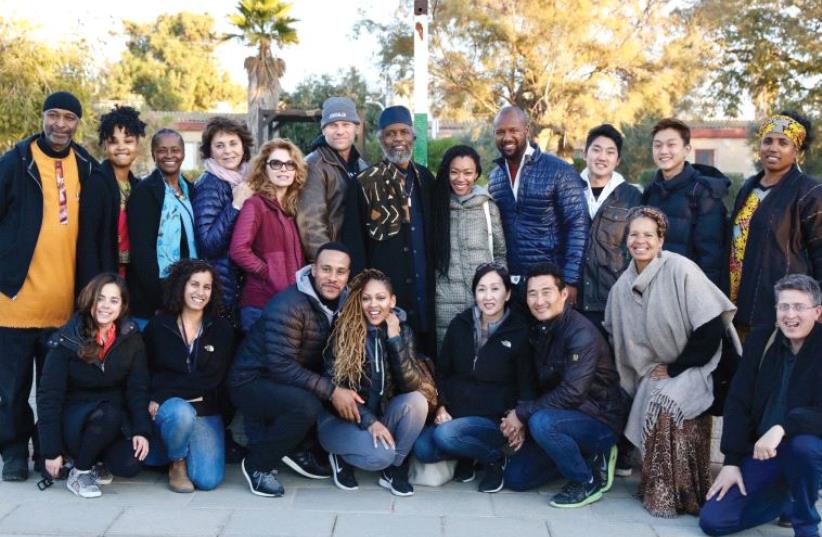 A GROUP of Hollywood TV actors including Mark Pellegrino (above, standing sixth from left) take part in an American Voices in Israel tour, which included a meeting with the Black Hebrews community in Dimona as well as a visit to the City of David. (photo credit: MINISTRY OF STRATEGIC AFFAIRS AND PUBLIC DIPLOMACY)