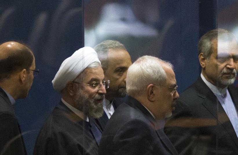 Iranian President Hassan Rouhani surrounded by goverment officials. (photo credit: REUTERS)