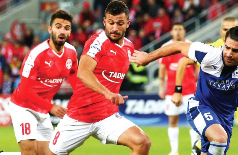 Hapoel Beersheba striker Mohammad Ghadir (center) scored his team’s second goal in last night’s 2-0 victory over Maccabi Tzur Shalom in the State Cup round-of-32. (photo credit: DANNY MARON)