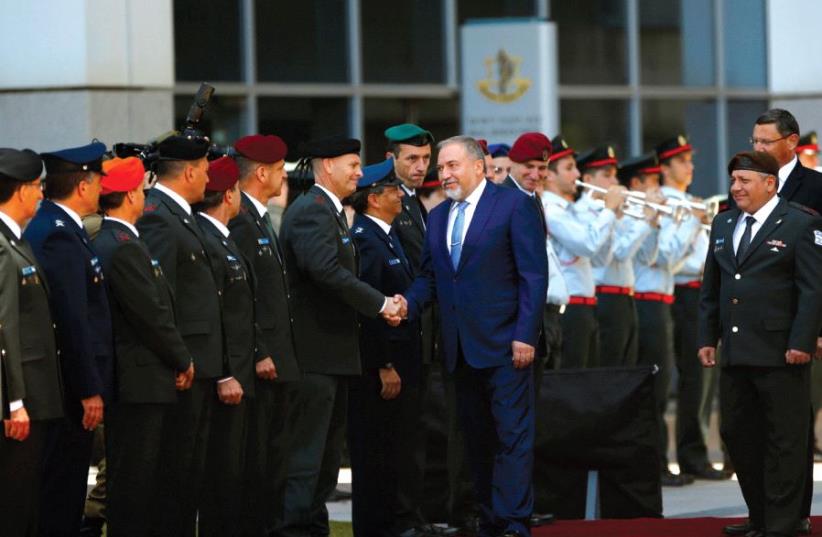 Amid harsh criticism of his record, Avigdor Liberman is sworn in as defense minister May 30 (photo credit: REUTERS)