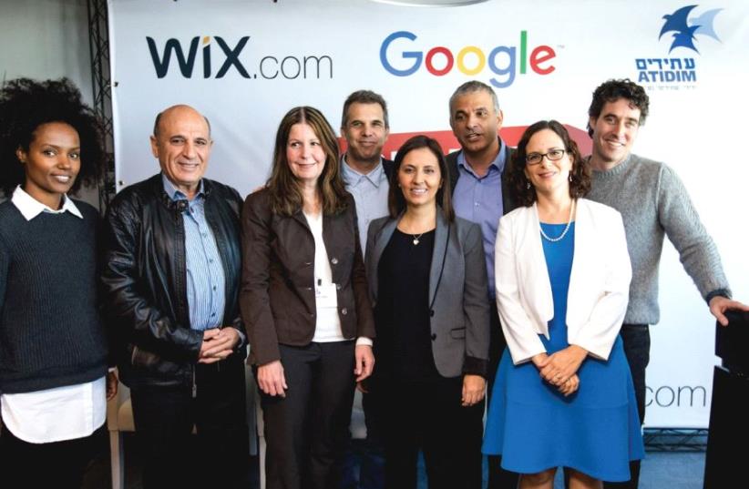 PARTICIPANTS AT the inauguration of the Digital Starter project pose yesterday. From right: WIX President Nir Zohar, MK Rachel Azaria, Finance Minister Moshe Kahlon, Social Equality Minister Gila Gamliel, Google Israel CEO Meir Brand, restaurateur Na’ama Weinman, Atidim founder Shaul Mofaz and Atidi (photo credit: TOMER POLTIN)
