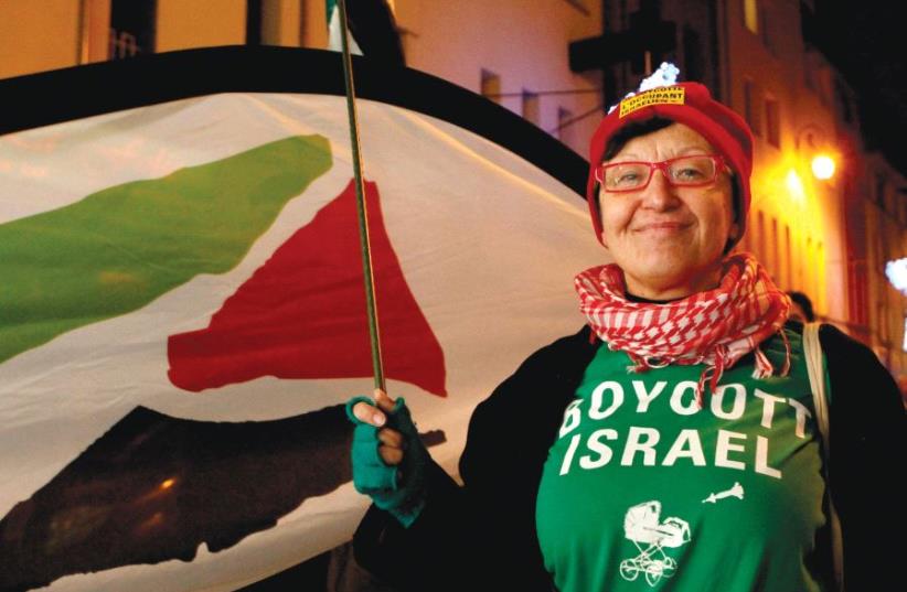 A WOMAN wearing a T-shirt that reads ‘Boycott Israel’ takes part in a pro-Palestinian demonstration in Brussels in 2011. (photo credit: REUTERS)