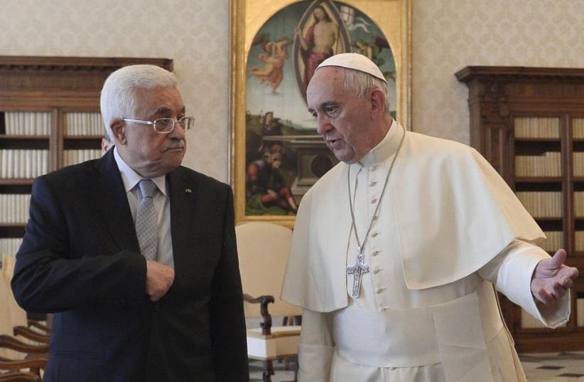 Pope Francis (R) talks with Palestinian President Mahmoud Abbas during a private audience at the Vatican City, May 16, 2015. (photo credit: REUTERS)