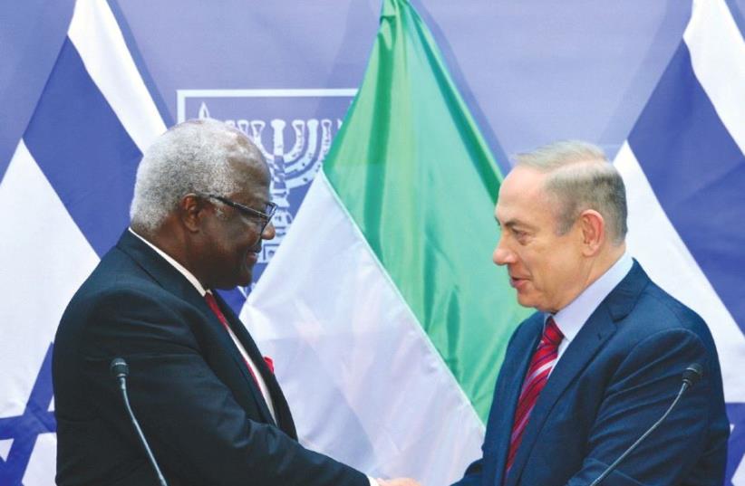 PRIME MINISTER Benjamin Netanyahu welcomes Sierra Leone President Ernest Bai Koroma in Jerusalem yesterday.  (photo credit: KOBI GIDEON/GPO)