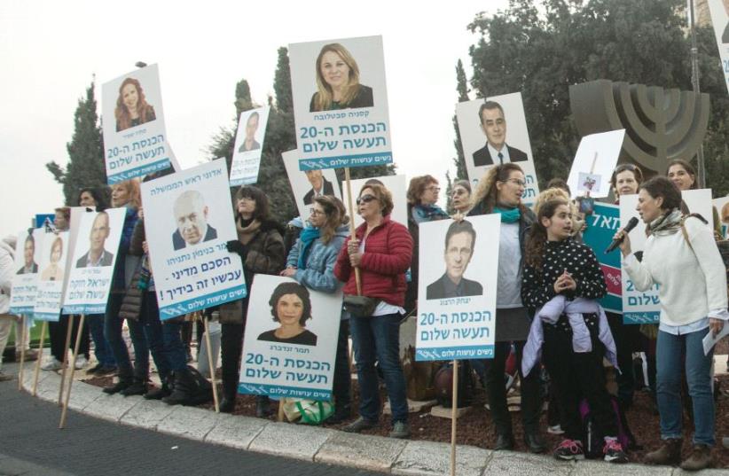 Members of the NGO Women Wage Peace stand near the Knesset in the capital last month (photo credit: SARAH LEVI)