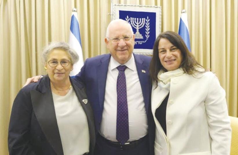 PRESIDENT REUVEN RIVLIN and his wife, Nechama (left), with Rona Ramon. (photo credit: AMOS BEN GERSHOM, GPO)