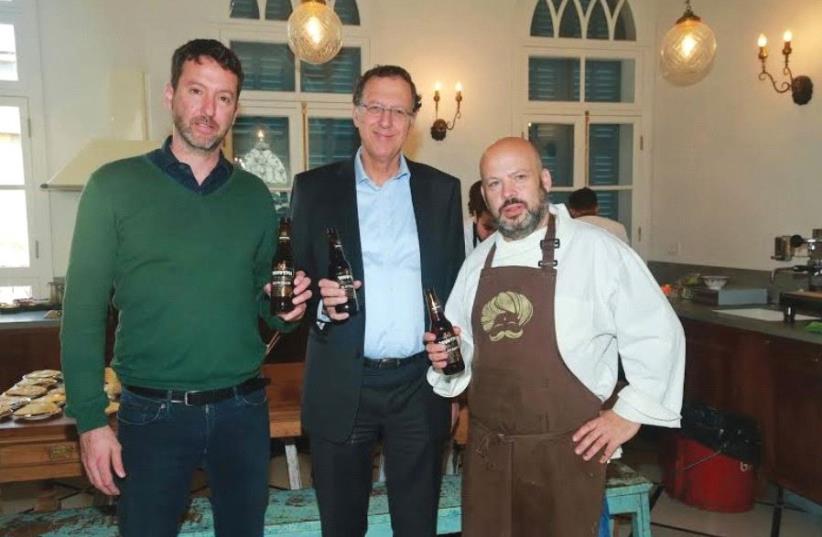 Deputy CEO of Tempo Yoash Ben Eliezer, CEO of Tempo Jack Bar and celebrity chef Yonatan Roshfeld at the launch of Goldstar Slowbrew. (photo credit: SHUKA COHEN)