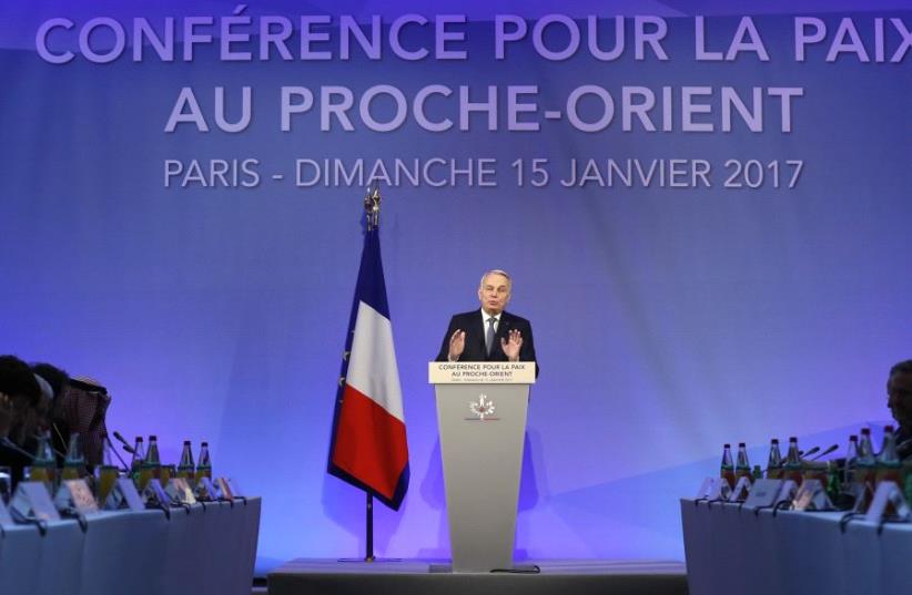 French Minister of Foreign Affairs Jean-Marc Ayrault addresses delegates at the opening of the Mideast peace conference in Paris, January 15, 2017 (photo credit: REUTERS)