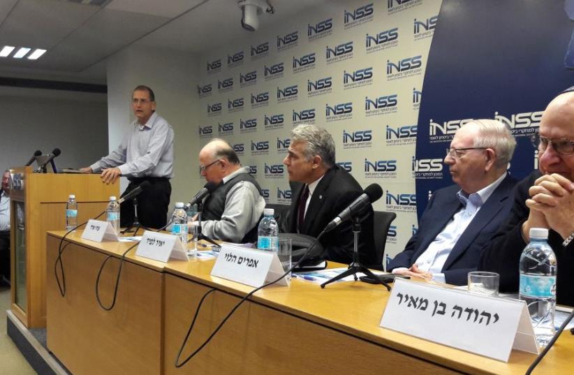 Yair Lapid (third from left) at the INSS conference on Jan. 15, 2017 (photo credit: YONAH JEREMY BOB)