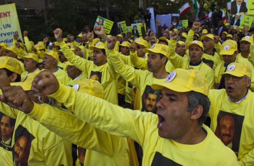 Supporters of Iran's main opposition, the Mujahedin-e Khalq, take part in a rally against Iranian President Hassan Rouhani. (photo credit: REUTERS)