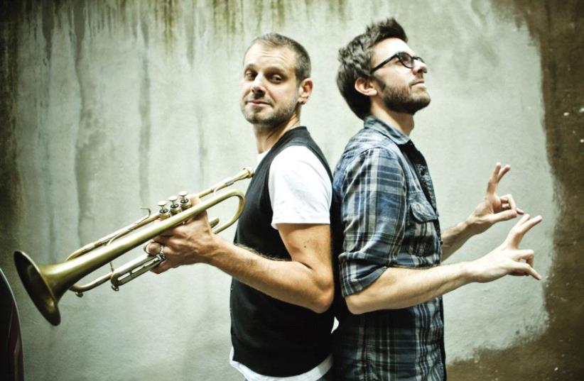 Trumpeter Fabrizio Bosso (left) with his longtime cohort, pianist Julian Oliver Mazzariello (photo credit: SIMONE CECCHETTI)
