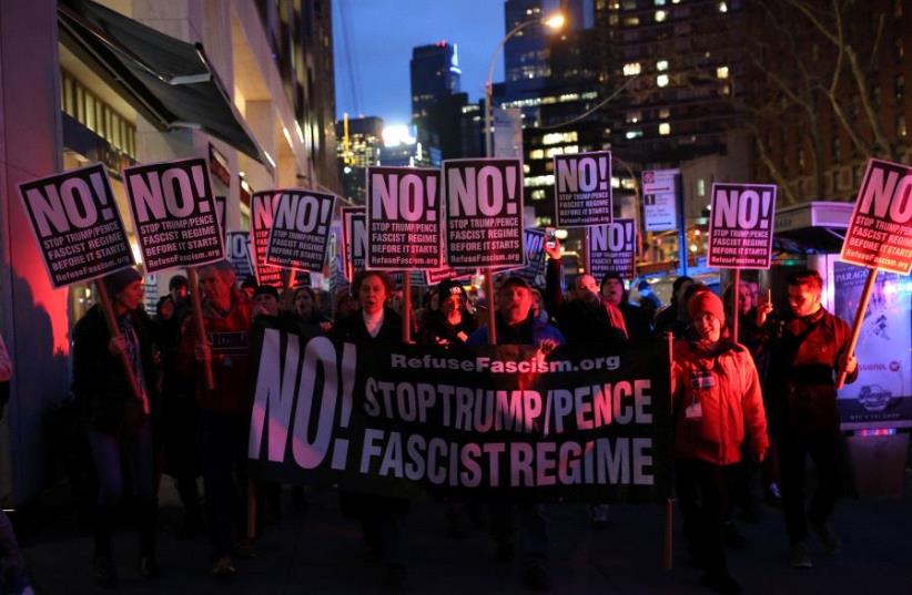 People rally against Donald Trump outside Trump International Hotel and Tower at Columbus Circle in Manhattan, New York City, US (photo credit: REUTERS)