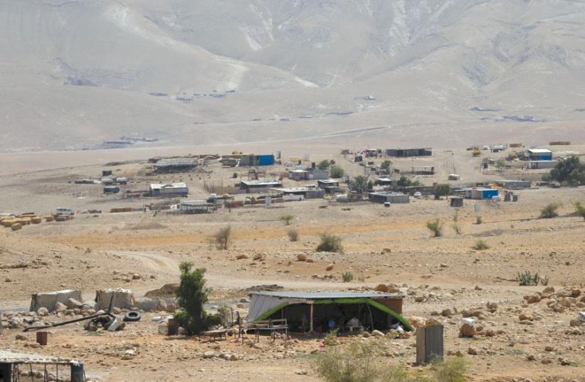 A PALESTINIAN Beduin village near Jericho. Disputes over land in the West Bank often end up decided by a military-run administration. (photo credit: REUTERS)