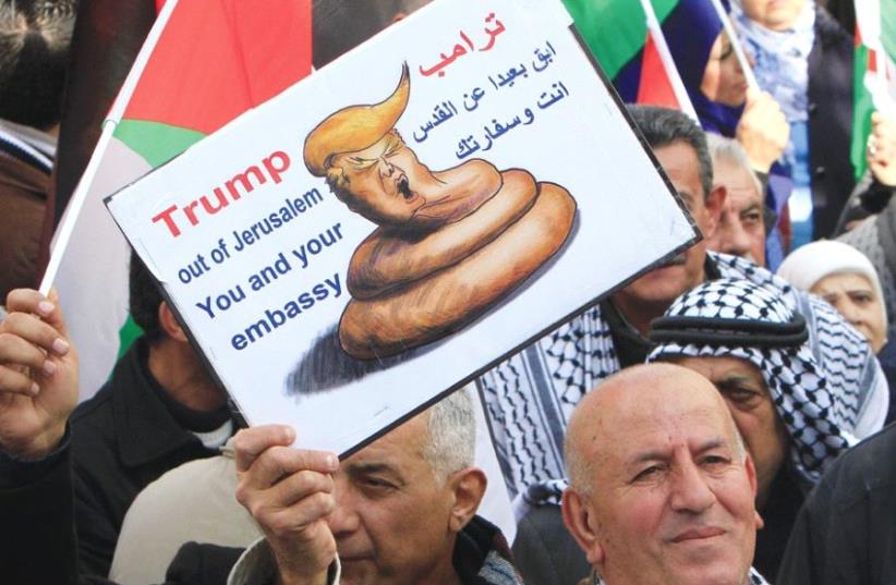 PALESTINIANS PROTEST in Nablus on Thursday against a promise by President Donald Trump to relocate the US Embassy to Jerusalem. (photo credit: REUTERS)