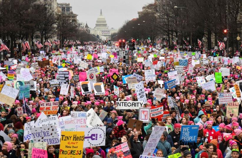 Hundreds of thousands march down Pennsylvania Avenue during the Women's March. (photo credit: REUTERS)