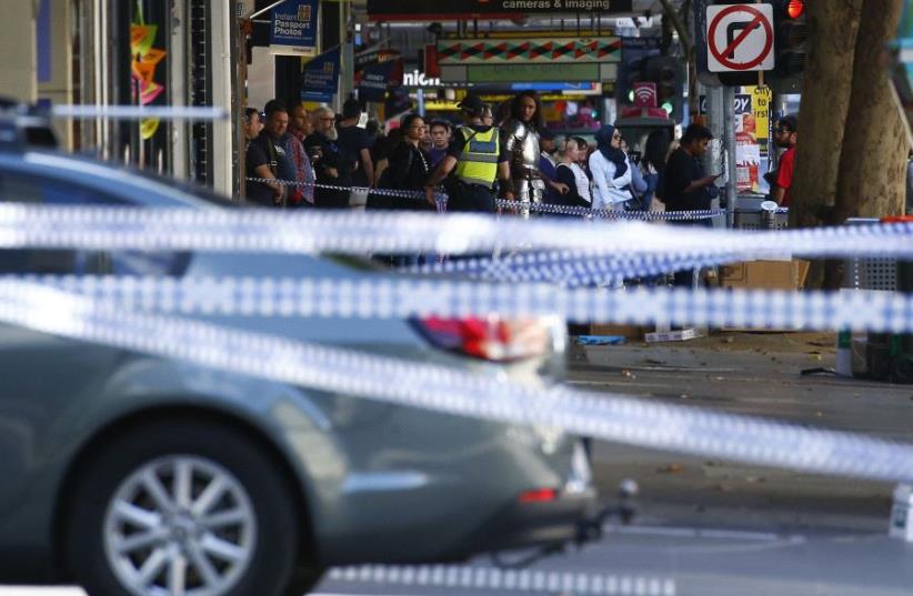 Police cordon off Bourke Street mall, after a car hit pedestrians in central Melbourne, Australia, January 20, 2017 (photo credit: REUTERS)