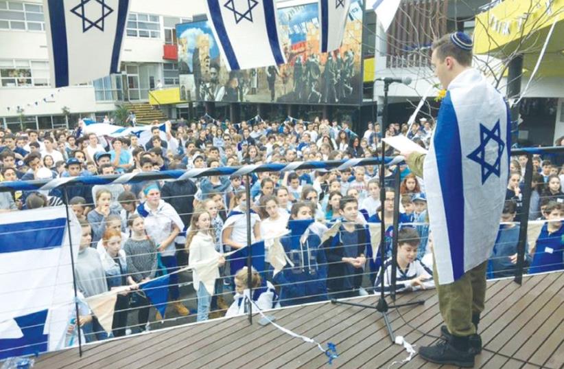STUDENTS CELEBRATE Israel Independence Day at Mount Scopus College in Melbourne last year. (photo credit: FACEBOOK)